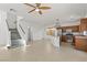 Bright open-concept kitchen with a center island, stainless appliances and adjoining dining area at 10650 Little Horse Creek Ave, Las Vegas, NV 89129