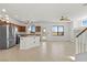 Open floor plan featuring an island kitchen, an adjacent dining and living area at 10650 Little Horse Creek Ave, Las Vegas, NV 89129