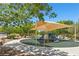 Playground featuring covered play structure with slide and green safety surface at 10650 Little Horse Creek Ave, Las Vegas, NV 89129
