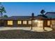 Relaxing backyard showcasing a covered patio, rock landscaping, and a calming atmosphere at 10712 Aire Dr, Las Vegas, NV 89144