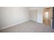 Minimalist bedroom with neutral carpet, closet, and a view of the hallway at 10712 Aire Dr, Las Vegas, NV 89144