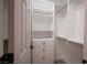 Well-organized walk-in closet with white shelving, drawers, and ample hanging space at 10712 Aire Dr, Las Vegas, NV 89144