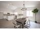 Open floor plan showing a dining area connected to a modern kitchen, perfect for entertaining at 10712 Aire Dr, Las Vegas, NV 89144