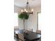 The dining room showcases a modern chandelier over a large dining table at 10712 Aire Dr, Las Vegas, NV 89144