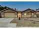 Charming single-story home featuring a well-maintained front yard with desert landscaping at 10712 Aire Dr, Las Vegas, NV 89144