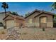 Charming single-story home with desert landscaping, a detached garage, and a welcoming exterior at 10712 Aire Dr, Las Vegas, NV 89144