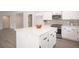 Modern kitchen with a large island, white cabinetry, and stainless steel appliances at 10712 Aire Dr, Las Vegas, NV 89144
