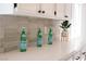 Bright kitchen features white countertops, light backsplash, and stainless steel appliances at 10712 Aire Dr, Las Vegas, NV 89144