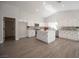 Bright kitchen featuring recessed lighting, island, white cabinets, and stainless appliances at 10712 Aire Dr, Las Vegas, NV 89144