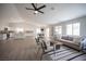 Bright open-concept living room, kitchen, and dining area filled with natural light at 10712 Aire Dr, Las Vegas, NV 89144