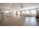 Bright open-concept living room, kitchen, and dining area filled with natural light at 10712 Aire Dr, Las Vegas, NV 89144