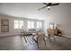 Cozy living room featuring a modern sofa, stylish chairs, and neutral decor at 10712 Aire Dr, Las Vegas, NV 89144