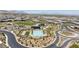 An aerial view of the desert community, featuring a pool, clubhouse, green space, and landscaping at 10927 White Clay Dr, Las Vegas, NV 89135