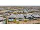 Aerial view of desert homes with modern designed backyards, landscaping, turf and pool at 10927 White Clay Dr, Las Vegas, NV 89135