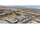 Aerial view of a vast community of desert homes with mountain views at 10927 White Clay Dr, Las Vegas, NV 89135