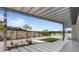 Backyard featuring a modern pergola and a small garden with desert landscaping at 10927 White Clay Dr, Las Vegas, NV 89135