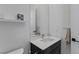 Bathroom featuring a single vanity with a white countertop and black accents at 10927 White Clay Dr, Las Vegas, NV 89135