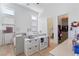Bright bedroom featuring twin beds, wood floors, and a walk-in closet at 10927 White Clay Dr, Las Vegas, NV 89135