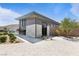 Beautiful modern clubhouse exterior, with large windows, landscaping, and view of the community pool at 10927 White Clay Dr, Las Vegas, NV 89135