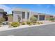 Contemporary home with modern design, minimalist landscaping, neutral color scheme, and paved driveway at 10927 White Clay Dr, Las Vegas, NV 89135