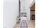 Bright foyer featuring hardwood floors, modern lighting, and an open floor plan with backyard views at 10927 White Clay Dr, Las Vegas, NV 89135