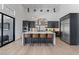 Gourmet kitchen featuring an island with seating, stainless steel appliances, and lots of natural light at 10927 White Clay Dr, Las Vegas, NV 89135