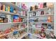 Well-organized pantry with ample shelving, storage containers, and a variety of food items at 10927 White Clay Dr, Las Vegas, NV 89135