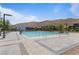 Outdoor pool and patio area featuring ample seating, clean landscaping, and a refreshing place to relax at 10927 White Clay Dr, Las Vegas, NV 89135