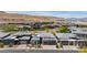 Wonderful street view of modern luxury homes in the community with desert hills in background at 10927 White Clay Dr, Las Vegas, NV 89135