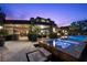 Luxurious backyard with a pool, spa, and outdoor seating, perfect for enjoying outdoor living at 11 Golden Sunray Ln, Las Vegas, NV 89135