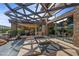 Backyard oasis with stone accents, a pergola, a water feature, and views at 11 Golden Sunray Ln, Las Vegas, NV 89135