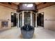 Unique bathroom featuring a standalone stone bathtub, elegant tile work, and modern fixtures at 11 Golden Sunray Ln, Las Vegas, NV 89135