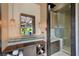 Bathroom with modern vanity, walk-in shower, and towel storage at 11 Golden Sunray Ln, Las Vegas, NV 89135