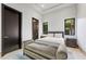 Bright bedroom with a cozy bench, ensuite bath and refreshing view at 11 Golden Sunray Ln, Las Vegas, NV 89135