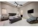 Modern bedroom with sleek furniture, large windows, and comfortable lounge chair at 11 Golden Sunray Ln, Las Vegas, NV 89135