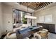Open-concept dining room with modern light fixture and views of the backyard at 11 Golden Sunray Ln, Las Vegas, NV 89135