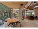 Dining room with an outdoor view, modern lighting and seating for six at 11 Golden Sunray Ln, Las Vegas, NV 89135
