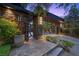 Elegant gated entrance with custom metalwork, stone pillars, and ambient lighting for added security at 11 Golden Sunray Ln, Las Vegas, NV 89135