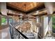 Grand foyer boasting soaring ceilings, exposed beam accents, and unique chandeliers at 11 Golden Sunray Ln, Las Vegas, NV 89135
