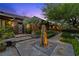 Stunning home exterior showcasing custom stonework, landscape lighting, and meticulously designed front entrance at 11 Golden Sunray Ln, Las Vegas, NV 89135