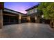 Spacious garage with modern glass doors and ample parking, integrated into the home's exterior design at 11 Golden Sunray Ln, Las Vegas, NV 89135