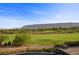 Expansive golf course view with mountain backdrop, visible from the backyard of this luxury home at 11 Golden Sunray Ln, Las Vegas, NV 89135