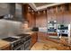 Modern kitchen with stainless steel appliances, granite countertops, and custom cabinetry at 11 Golden Sunray Ln, Las Vegas, NV 89135