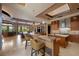 Open kitchen layout with granite countertops, island seating, and stainless steel appliances at 11 Golden Sunray Ln, Las Vegas, NV 89135