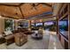 Elegant living room featuring a cozy seating area, fireplace, and access to the patio at 11 Golden Sunray Ln, Las Vegas, NV 89135