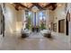 Expansive living room with soaring ceilings, fireplace, grand windows, and stylish decor, ideal for entertaining at 11 Golden Sunray Ln, Las Vegas, NV 89135