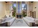 Elegant living room showcasing tall ceilings, a striking fireplace, and an open layout, enhanced by upscale furnishings at 11 Golden Sunray Ln, Las Vegas, NV 89135