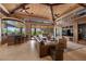 Comfortable living room featuring a full bar, recessed lighting, and access to an outdoor living space at 11 Golden Sunray Ln, Las Vegas, NV 89135