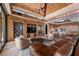 Spacious living area with high ceilings, built-in entertainment center, and abundant natural light at 11 Golden Sunray Ln, Las Vegas, NV 89135