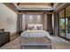 Serene main bedroom featuring a plush bed, elegant decor, and a peaceful view of the outdoors at 11 Golden Sunray Ln, Las Vegas, NV 89135
